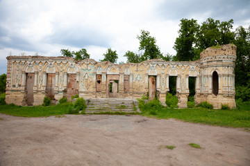 Fototapeta na wymiar The ruins of the Palace von der Osten Saken on the border of the town of Nemeshaevo and the village of Mirotskoye, Kiev region, Ukraine. Abandoned old manor. The remains of a brick house.