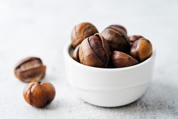 Chestnuts peeled and peeled in a white bowl