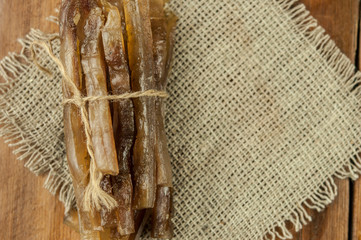 smoked fish on a wood background and copy space.