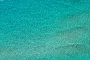 Naklejka na ściany i meble Aerial view of clear shallow water on sand bar off Miami Beach, Florida on bright sunny summer morning.