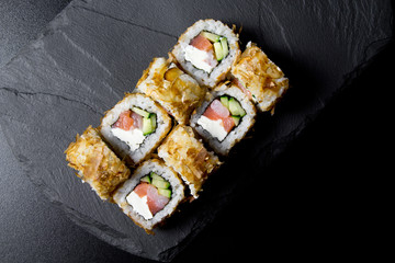Sushi bonito roll on a dark background. Top view of sushi . Sushi food photo for menu.