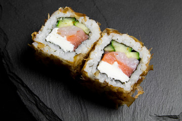 Sushi bonito roll on a dark background. Top view of sushi . Sushi food photo for menu.