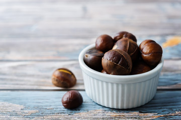 Chestnuts peeled and peeled in a white bowl