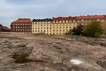 Historical residential buildings and bedrock in Helsinki, Finland