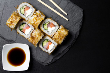 Sushi bonito roll on a dark background. Top view of sushi . Sushi food photo for menu.