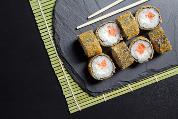 Sushi roll tempura with prawns. Top view of sushi . Sushi food photo for menu.