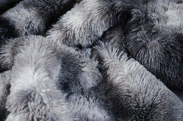 Gray and white synthetic fur close up.