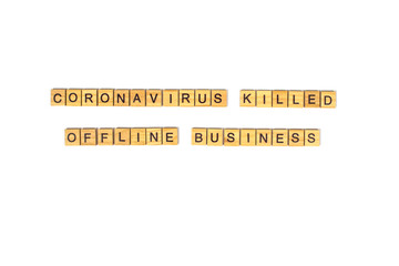 Coronavirus killed offline business - inscription written with black letters on wooden blocks. After covid-19 quarantine crisis concept. Words isolated on white