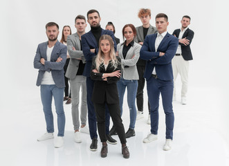 Obraz premium confident young woman standing in front of work group.