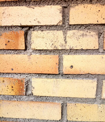 yellow brickwork smeared with cement mortar
