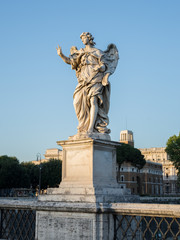 Fototapeta na wymiar Full size statue of Angel with the Nails on Ponte Sant'Angelo in Rome near Castel Sant'Angelo