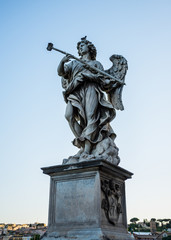 Fototapeta na wymiar Full size statue of Angel with the Sponge on Ponte Sant'Angelo in Rome near Castel Sant'Angelo