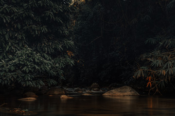 Smooth waterfall on dark-colored rocks