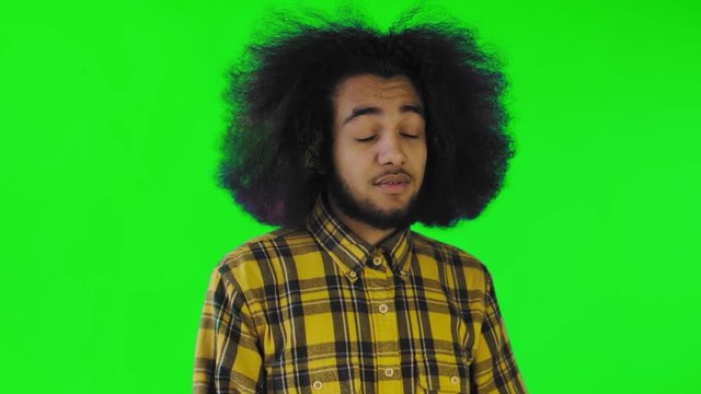 Afro-American Man Gesturing Thumbs Down on green screen or chroma key Background