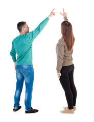 Fototapeta premium Back view of couple in sweater with mobile phone.