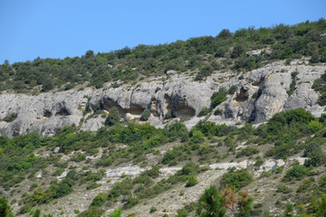 Fototapeta na wymiar Ancient quarries in rocks. Evidence of an ancient highly developed civilization. Crimean peninsula.