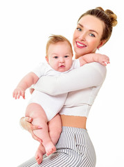 Mother and baby playing and smiling. Happy family.