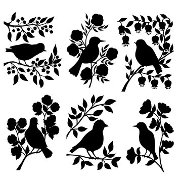 Set of bird silhouettes in flowers