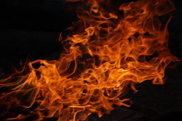 Flames from a burning fire on a black background