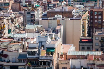 Fototapeta premium close up shots of various colourful houses roofs of Barcelona in a beautiful sunny day from high point of view