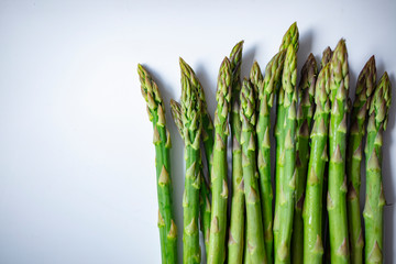 A bunch of asparagus await a fine meal. Asparagus. Raw asparagus. Fresh Asparagus.Green Asparagus. Vegetables: Asparagus Isolated on White Background