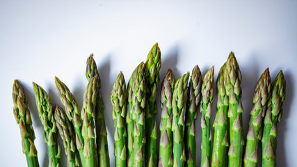 A bunch of asparagus await a fine meal. Asparagus. Raw asparagus. Fresh Asparagus.Green Asparagus. Vegetables: Asparagus Isolated on White Background