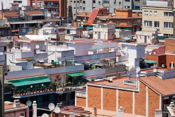close up shots of various colourful houses roofs of Barcelona in a beautiful sunny day from high point of view