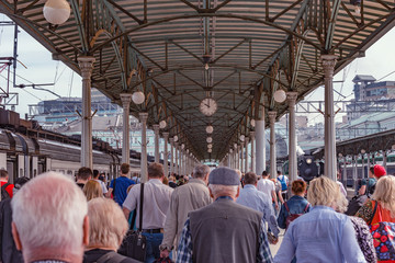 Crowd of people on the railway platform.
