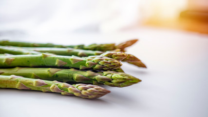 Green asparagus sticks isolated on white background. Studio shot. Vegetables: Asparagus Isolated on White Background. Fresh ripe asparagus on a white background