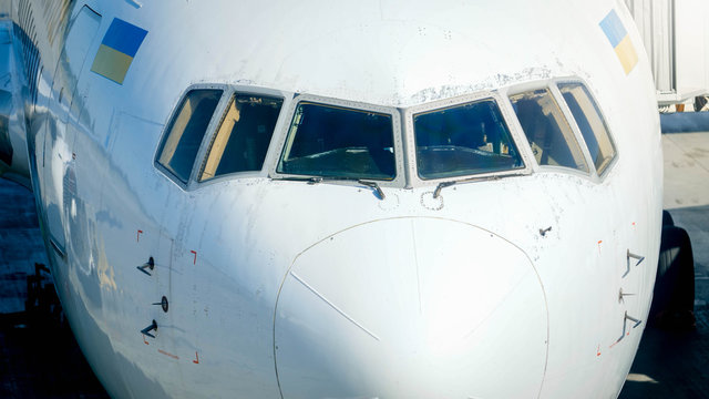 Nose of the airplane with pilot cockpit and wide windshield