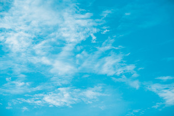 White clouds in the blue sky on a bright day