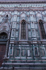 Exterior / facade of the Cathedral of Santa Maria del Fiore in Florence, Italy. A part of facade wall with a tall window