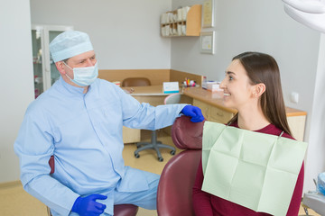 Doctor dentist with patient in clinic
