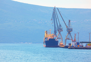 Naklejka premium sea port with industrial cranes 