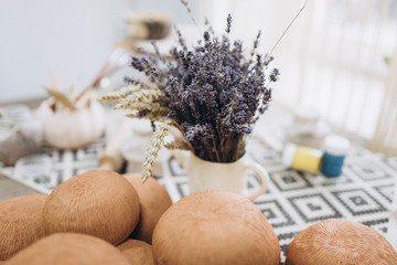 The potter's hands are shaped a cup from a clay. The process of creating pottery. The master ceramist works in his studio. Close-up, only hands. Crockery from clay own hands.	