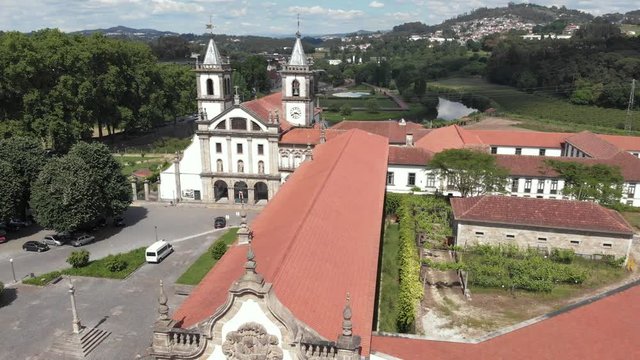 AERIAL DRONE FOOTAGE - The Monastery of St. Benedict (Sao Bento) in the city of Santo Tirso, Portugal, with the Ave River in the background. The Municipal Museum Abade Pedrosa.