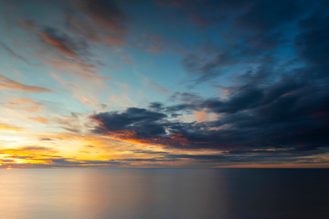 Naklejka na ściany i meble Cloudy sunset over ocean, Sweden