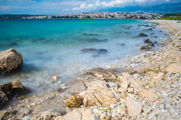 Picturesque coastal view of Novalja town and pebble beach on Pag island in Croatia