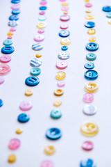 Flat lay with colorful sewing buttons, mock up, top view.