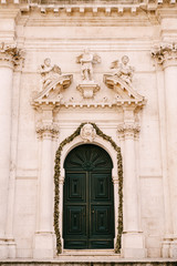 Fototapeta na wymiar Sculptures of Angels above the entrance of Saint Blaise Church In Dubrovnik, Croatia
