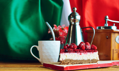 raspberry cheesecake with italian flag, cup of coffee  - patriotic breakfast Italy