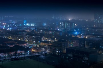 Fototapeta na wymiar High Angle Shot Of Illuminated City At Night