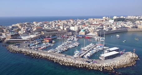 Fototapeta na wymiar Acre Israel: Aerial footage of the old City and the ancient port and marina.