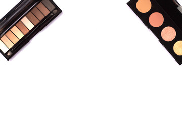 Highlighter and skin shadows are located in the corners with a place for text. Cosmetics