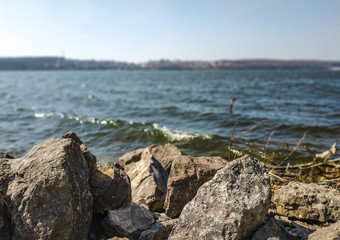 stones on the river bank waves