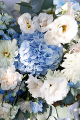 the wedding ceremony is decorated with flower arrangements and candle stands in a country complex