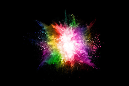 abstract colored dust explosion on a black background.abstract powder splatted background,Freeze motion of color powder exploding/throwing color powder, multicolored glitter texture.