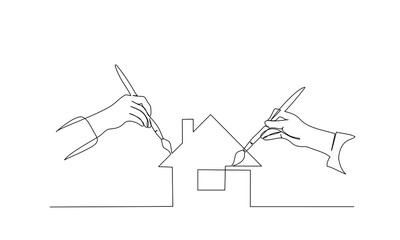 Two hands of people painting house with paintbrush