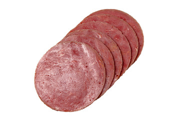 Sliced sausage slices lie on a white background. Isolated.