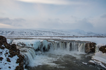 Godafoss waterfall on a snowy winter day